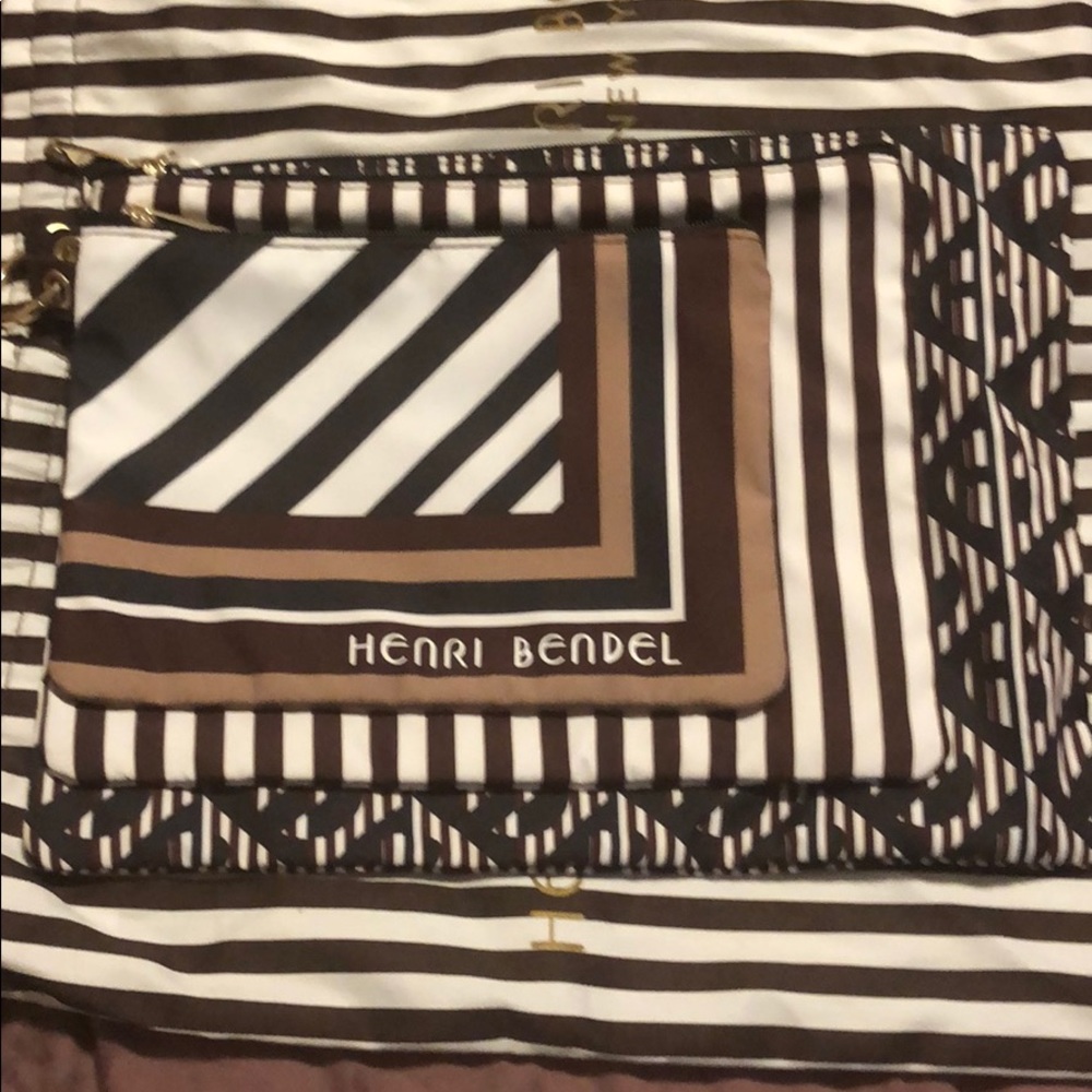 Triple zip Henri Bendel pouches.